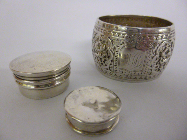 Two silver gilt lidded pots, hallmarked 1918 & 1903, together with a silver hallmarked napkin