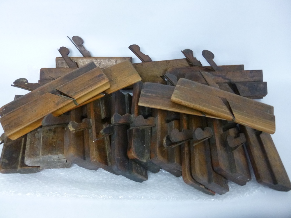 Twenty vintage wood planes