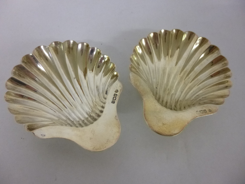 Pair of silver scallop shaped butter dishes on ball feet, by maker William Hutton hallmarked