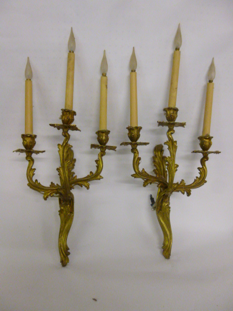 Pair of Louis XV style ormolu three branch candle scones/wall lights with flowing foliate design,