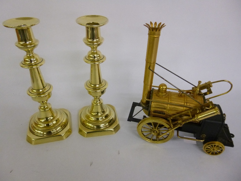 Pair of brass 9.5" candlesticks with pushers together with a 1970's Waco battery operated radio of