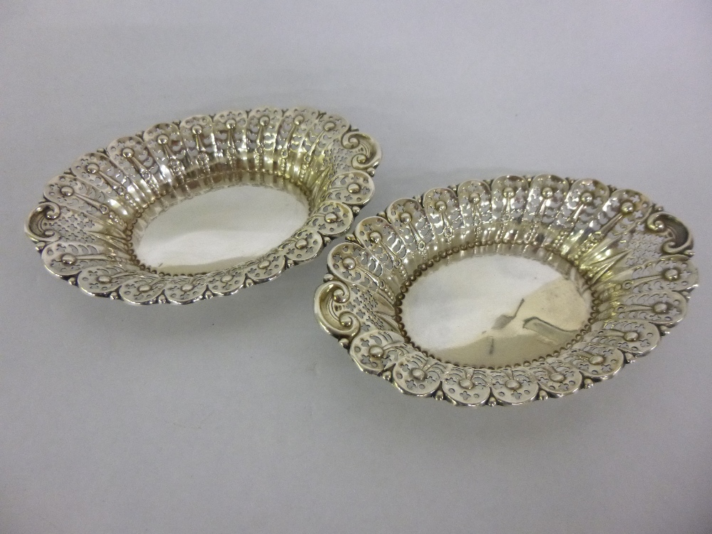 Pair of pierced silver bonbon dishes, James Dixon & sons, Sheffield 1928/9, each 12.5cms in