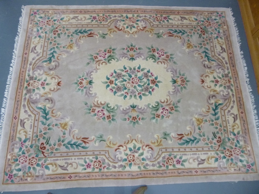 Large pink & cream rug with scrolled floral decoration, 300 x 240 cms approx