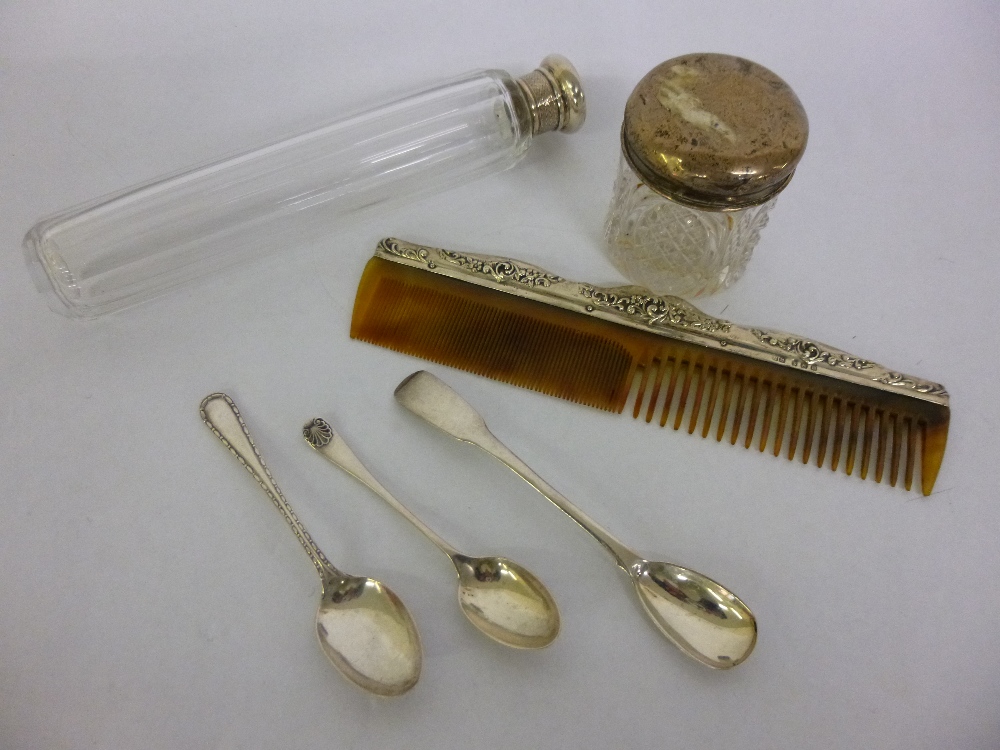 Collection of silver hallmarked items to include a glass vanity pot, comb, two spoons, early 19th