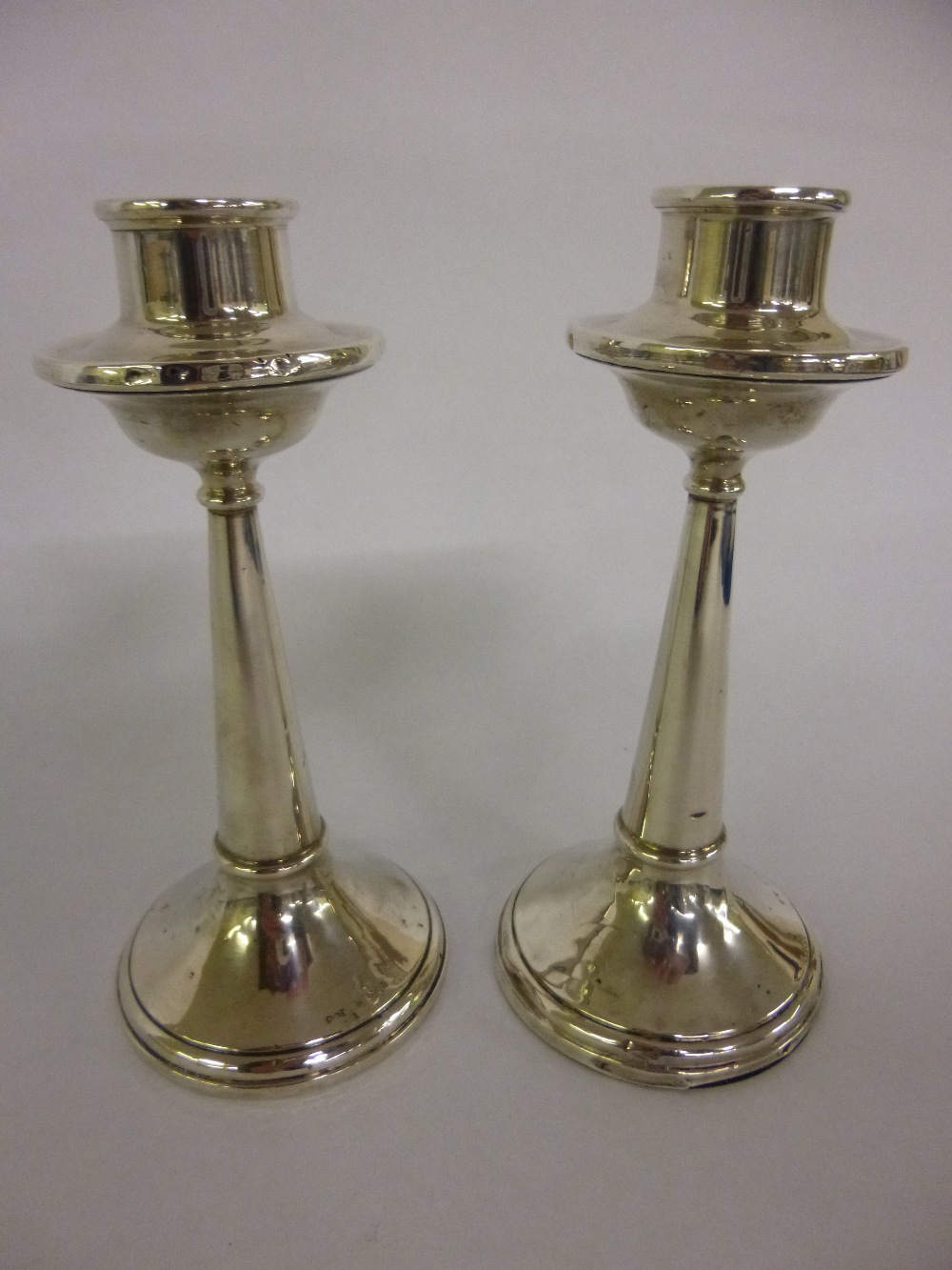 Pair of silver candlesticks, 14cms in height, Birmingham 1924