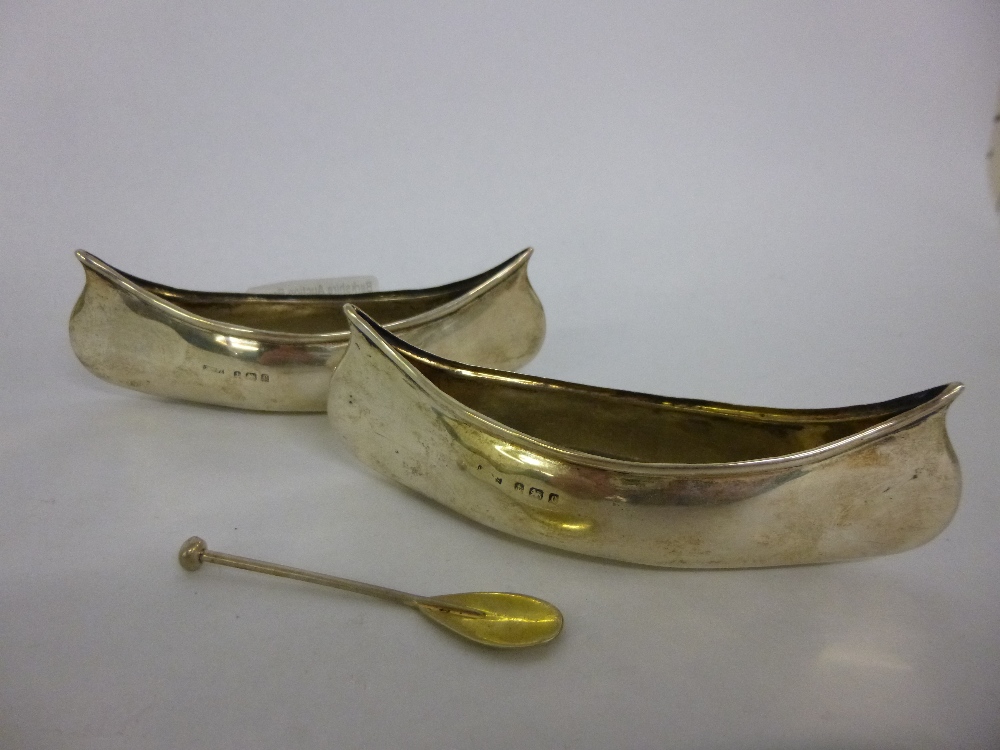 Pair of silver Canadian canoes, one with associated silver paddle, hallmarked Birmingham 1902,