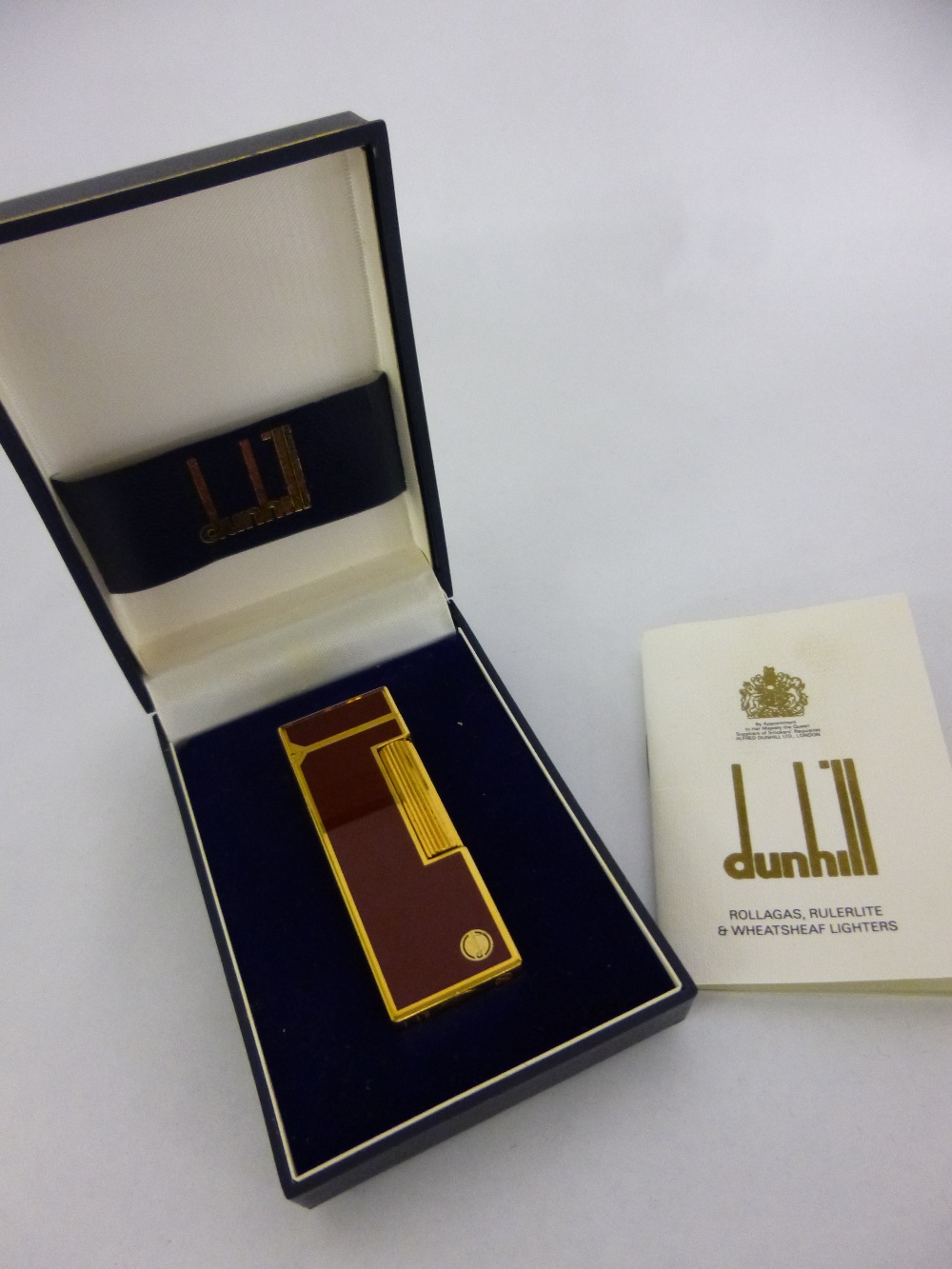 Dunhill burgundy & gold plated Rollagas cigarette lighter with original box & leaflet