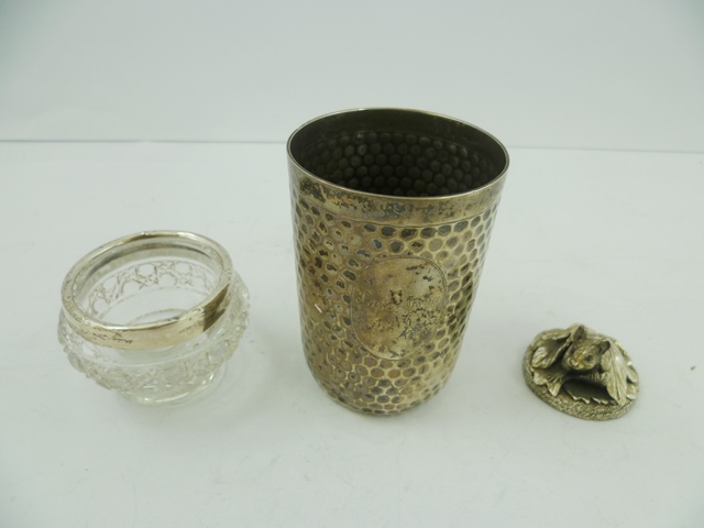 A FOREIGN SILVER COLOURED METAL BEAKER, having all over spot hammered decoration, stamped .800, 85mm