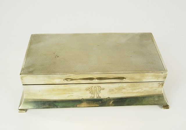 ** CO. LTD A SILVER RECTANGULAR TABLE TOP CIGARETTE BOX having hinged engine turned lid and plain