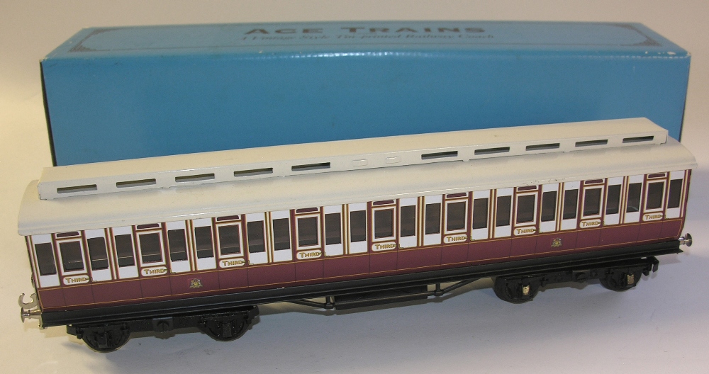 A boxed Ace Trains `0` gauge tinplate 3rd class passenger coach.