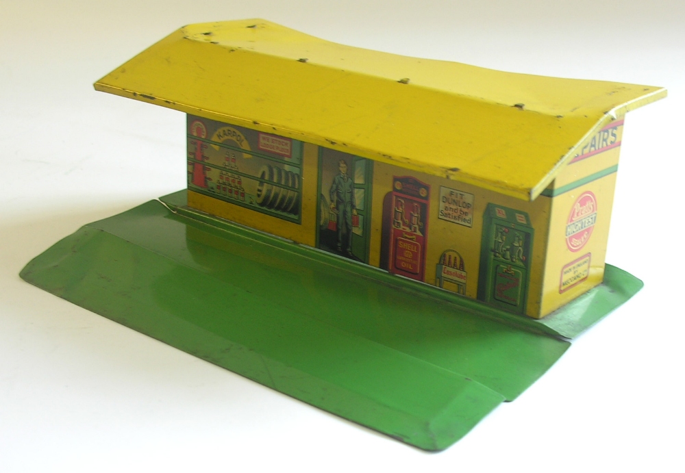 A 1930s Meccano tinplate petrol station.