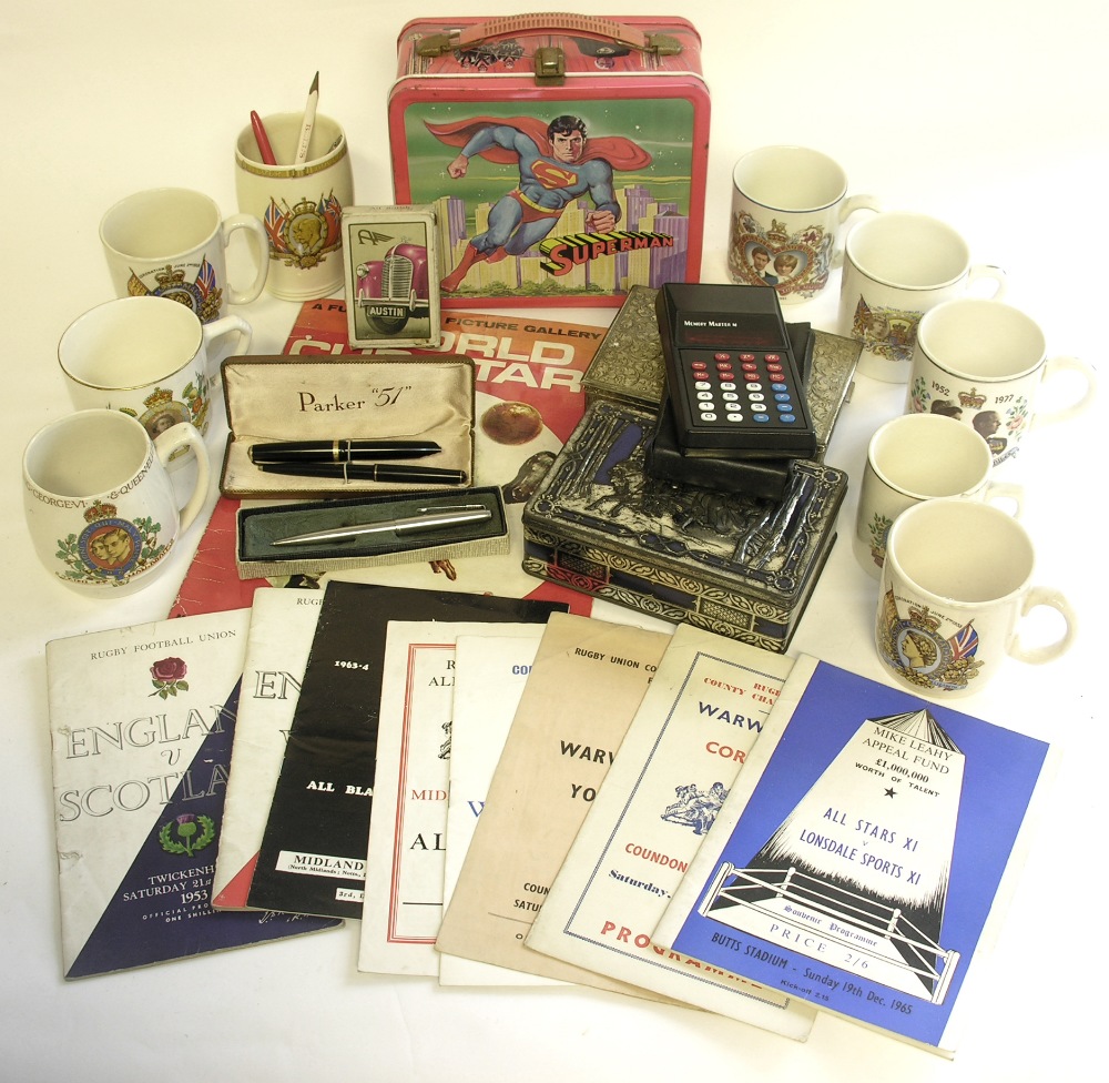 A collection of various Royal commemorative mugs, a `Superman` lunch box, playing cards, Parker `51`