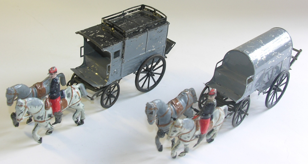Two French tinplate horse drawn vehicles.