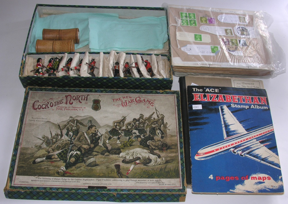 A boxed F. H. Ayres `Cock O` The North` War game together with a collection of various stamps,