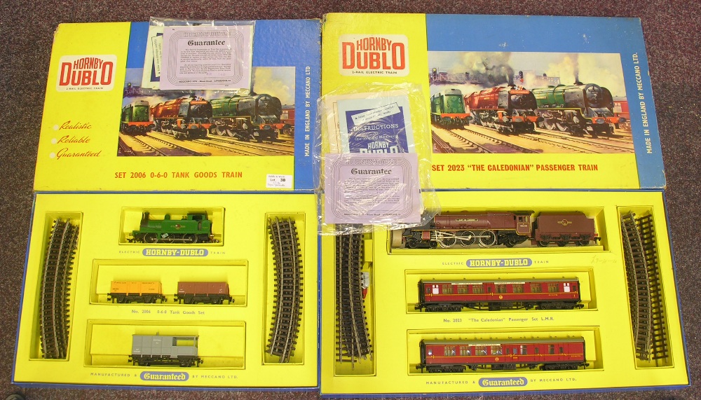 Two boxed Hornby Dublo sets to include 2006 0-6-0 Tank Goods Train and 2023 "The Caledonian"