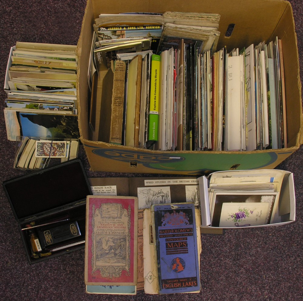 A box of various items to include a quantity of maps and guides, cigarette and tea cards and a