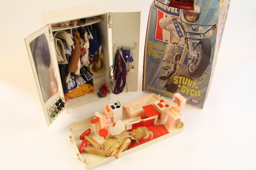 A boxed Ideal Evel Knievel Stunt Cycle, a Sindy bed and wardrobe with a collection of Sindy