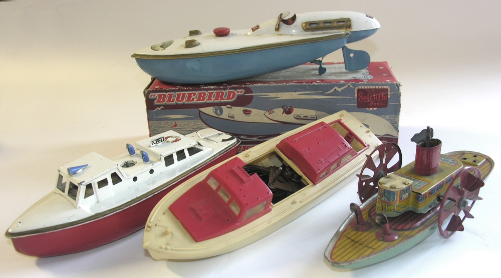 A boxed Sutcliffe `Bluebird` speedboat, a Sutcliffe tinplate `Pilot` launch, a Hornby plastic