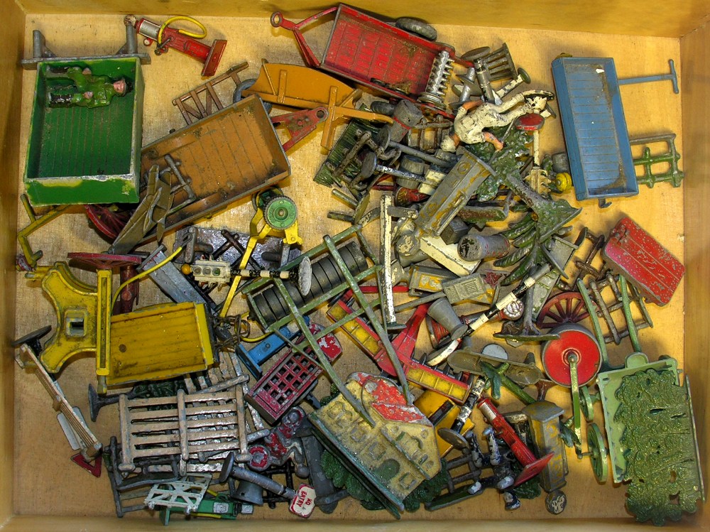 A collection of playworn Britain`s diecast farm vehicles, figures, buidlings etc.