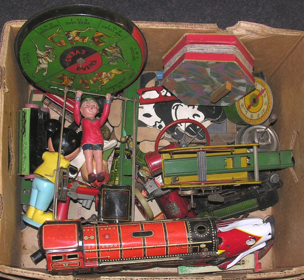 A collection of 1950s and later tinplate vehicles and games, to include C. K. `Alps` `Over the