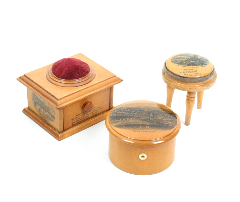 Three pieces of Mauchline ware: A miniature three legged stool as a pincushion (Stirling Castle From