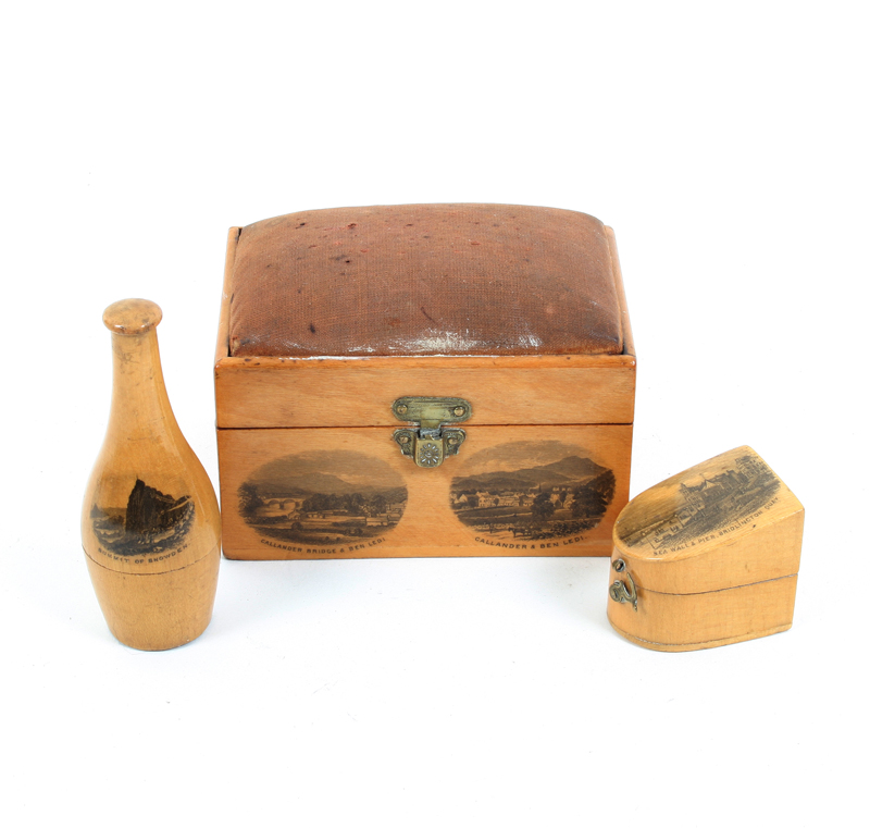 Three pieces of Mauchline ware: A skittle form thimble and reel case (Summit of Snowden), 8cm, a