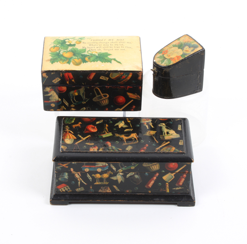 Three pieces of Mauchline ware: A rectangular reel box in the Toys and Games pattern, interior lid
