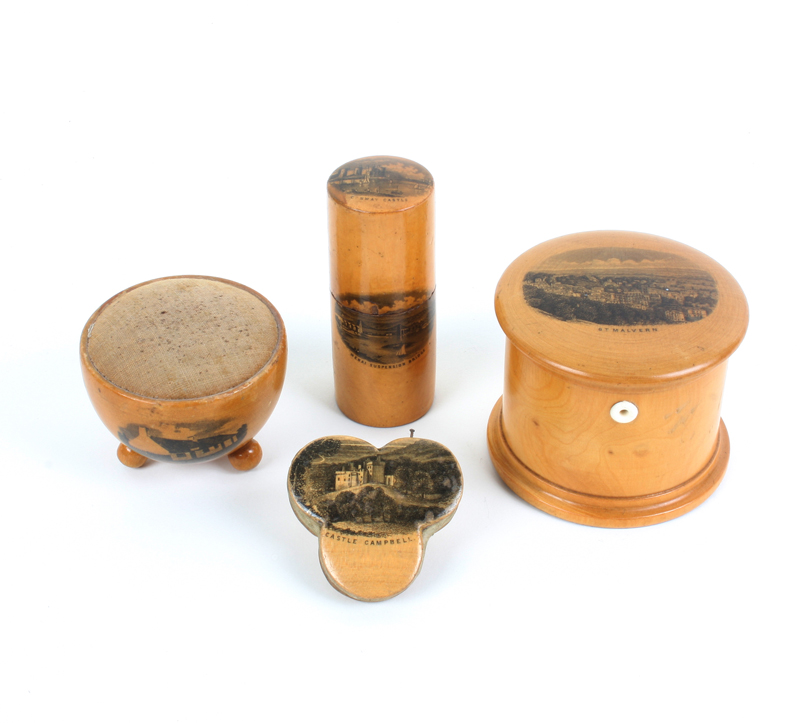 Four pieces of Mauchline ware: A cotton box of cylinder form, with side aperture (Great Malvern),