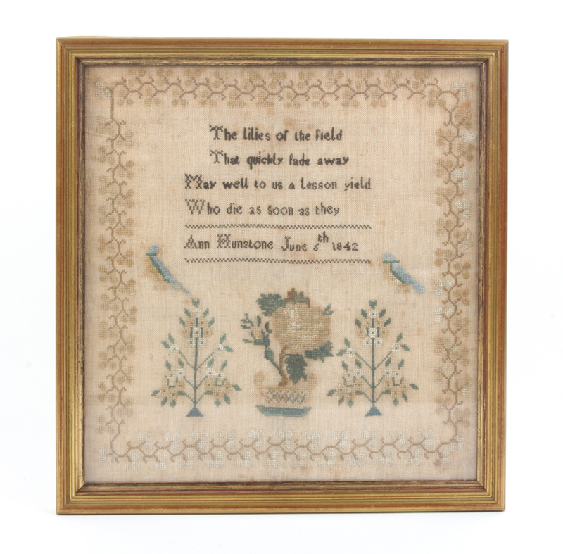 A small sampler dated 1842, by Ann Hunstone, worked with a verse above birds, trees and a jardiniere