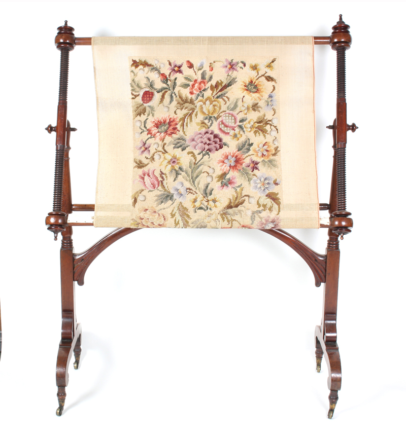 An early 19th century mahogany adjustable floorstanding embroidery frame, the tilting frame on