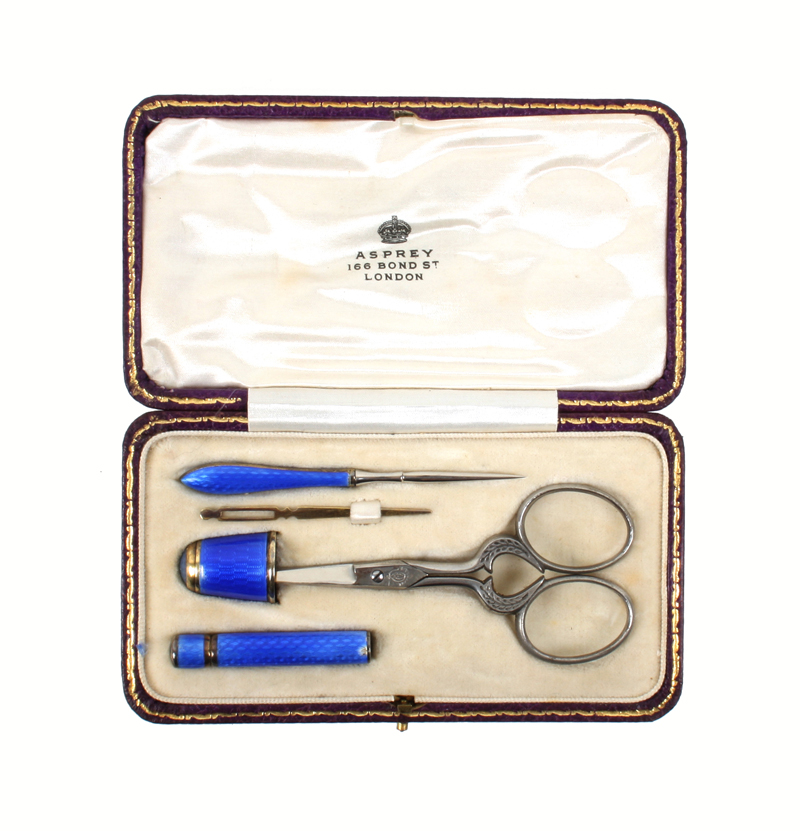 A silver and blue guilloche enamel sewing set by Asprey, in rectangular leather case initialled “R.
