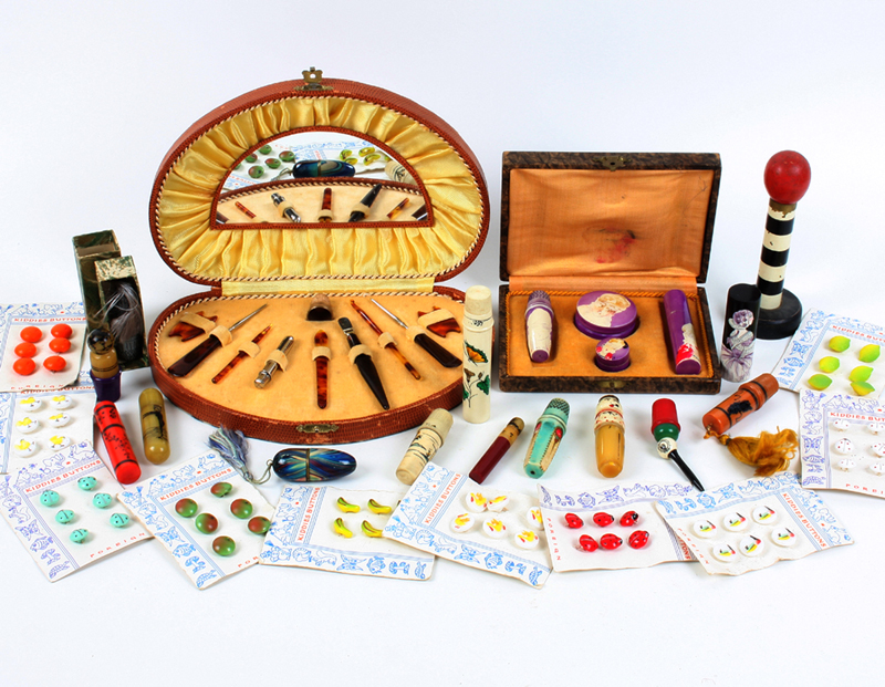 A 1930s cased sewing and perfume set, in plastic, painted with female heads, cased, 14cm, a