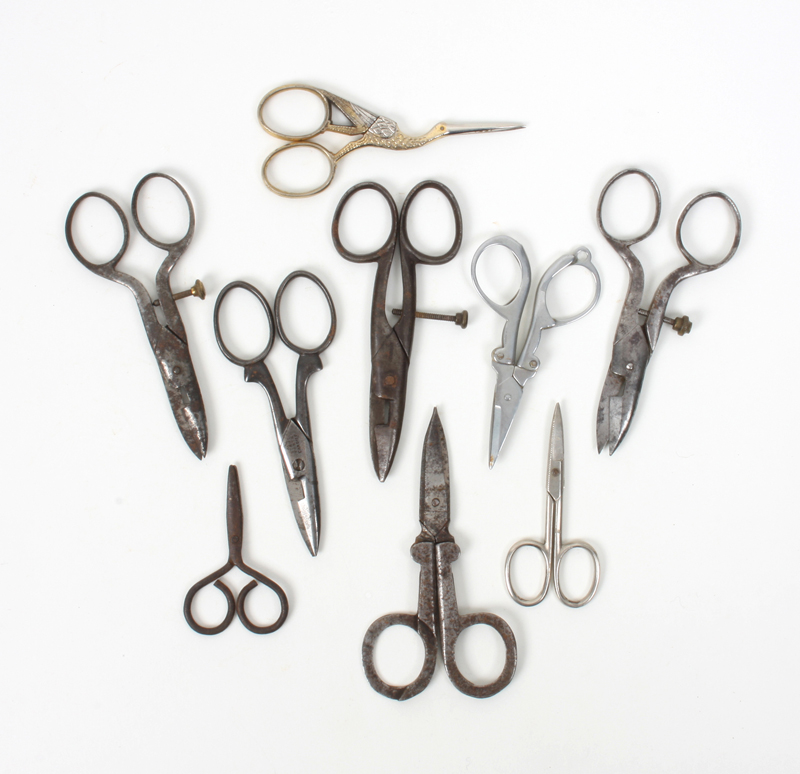 Nine pairs of 19th century and later steel scissors, including three adjustable button holing