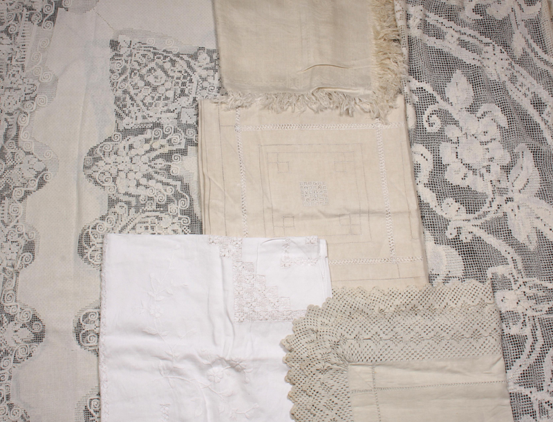 An openwork tablecloth, worked with geometric motifs within a conforming border (5ft x 7ft 6ins),