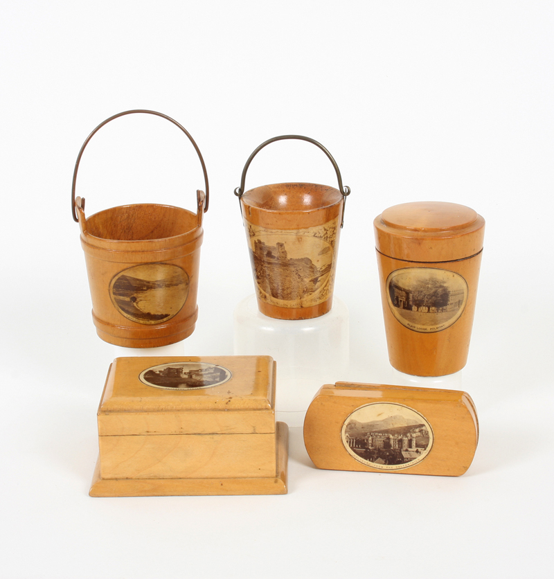 Five pieces of Mauchline ware, comprising: A tapering tumbler case with fern engraved glass (