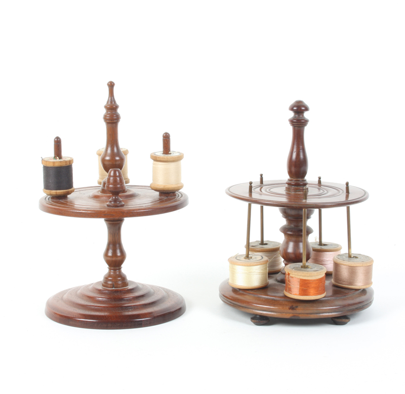 A 19th century turned mahogany reel stand, the two circular tiers divided by a baluster stem,