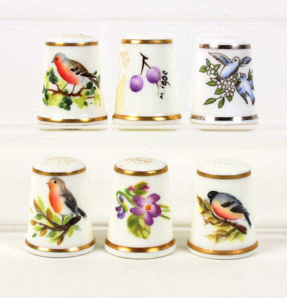 Five black mark Royal Worcester hand painted thimbles, three of birds, one of fruit, one of flowers,