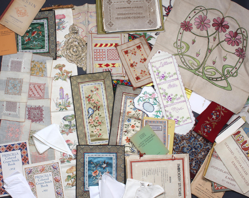 A quantity of needlework, to include: An Art Nouveau style embroidered cushion cover, a bell pull