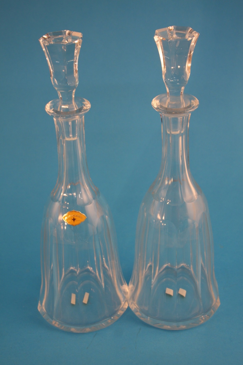 A pair of tall Josephinenhutte clear glass 20th century facet cut decanters, bears label. (2) 34.5