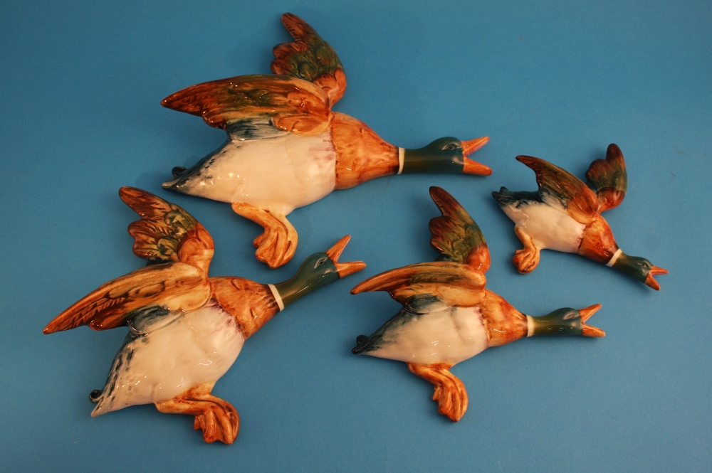 A set of four graduating Beswick flying ducks, numbered 596, 1/2/3/4, printed marks.