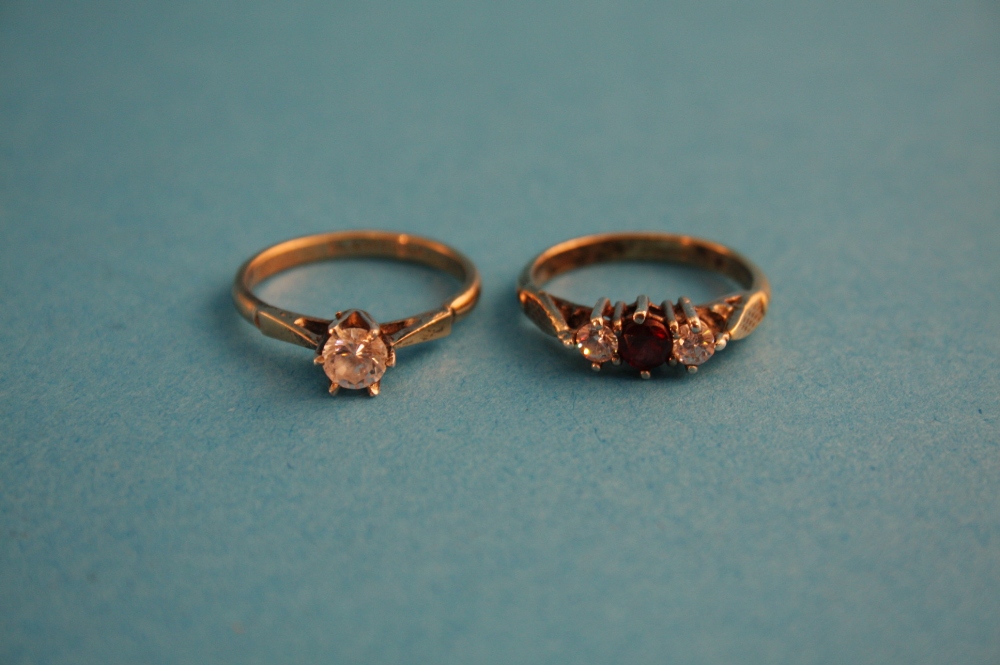 Two gold and silver dress rings.