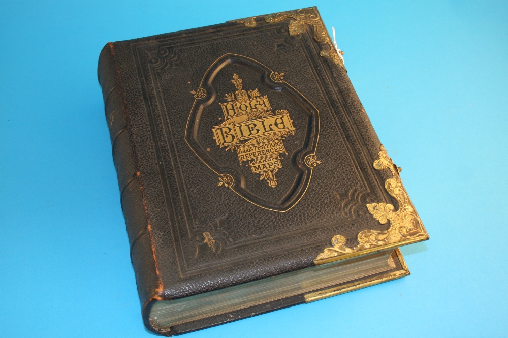 A Victorian family Bible, leather bound and gilt metal mounts.