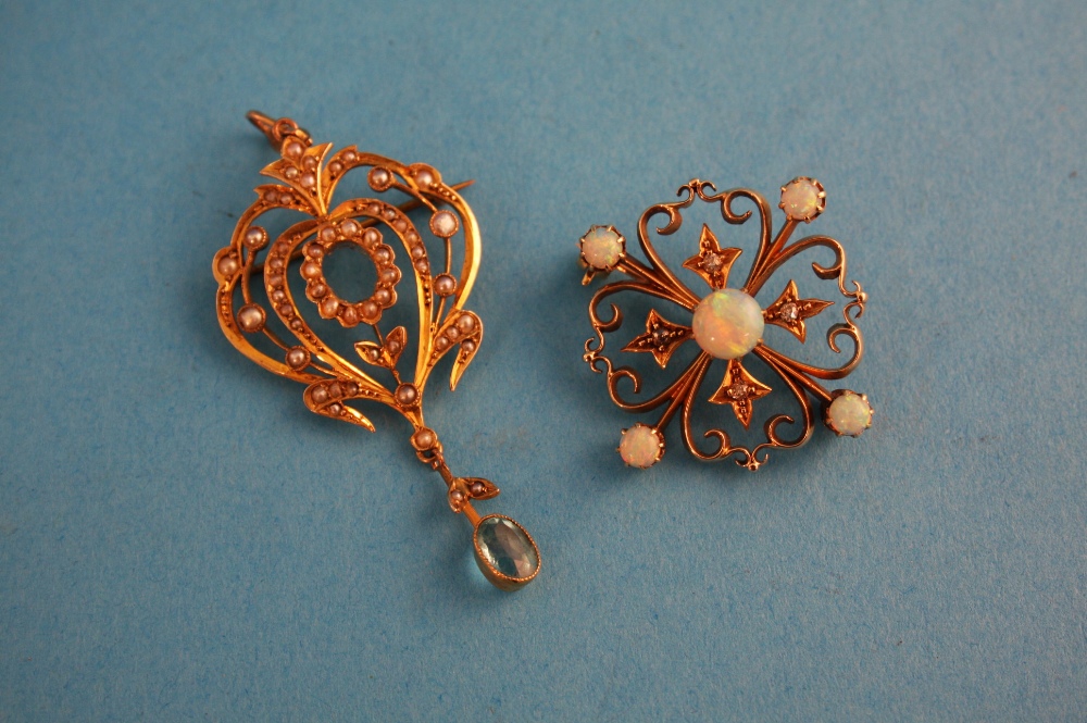 A Victorian 9ct gold brooch set with five small opals; and a pendant set with seed pearls.