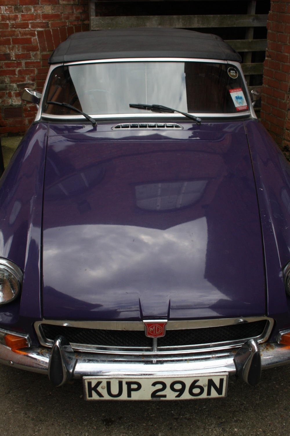 An M.G.B. convertible car, registered 27th June 1975, 1798 CC, petrol, purple, mileage 48,399 (