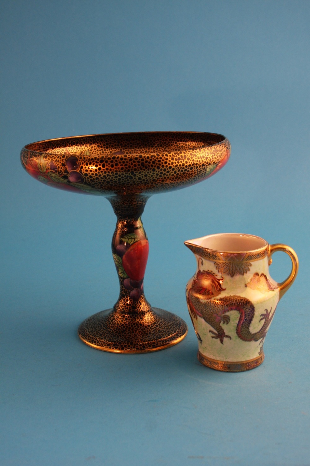 A Maling tazza "Pomegranate" numbered 3615; and a small Maling jug "Dragon" numbered 5251. (2)