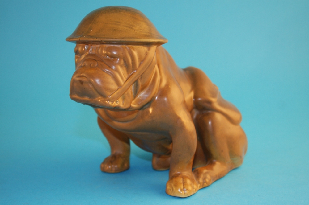 A rare Royal Doulton "Old Bill" Bull Dog HN146 in olive green, wearing a helmet and haversack,