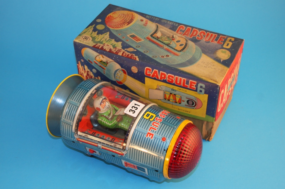 A Japanese boxed tinplate battery operated "Capsule 6".