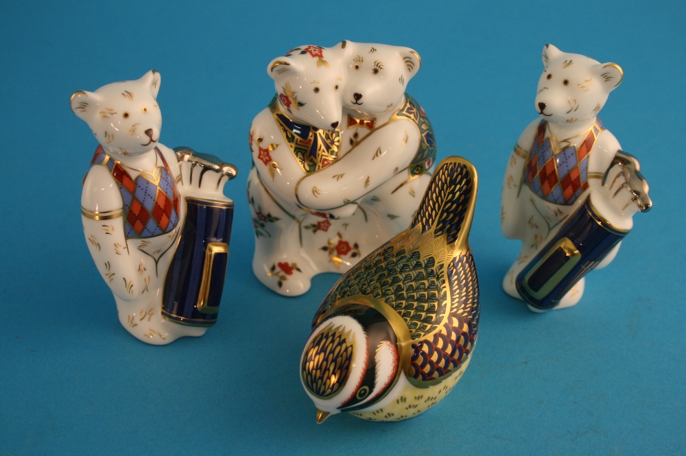 A Royal Crown Derby paperweight "Bullfinch" and 3 Royal Crown Derby teddy bears.