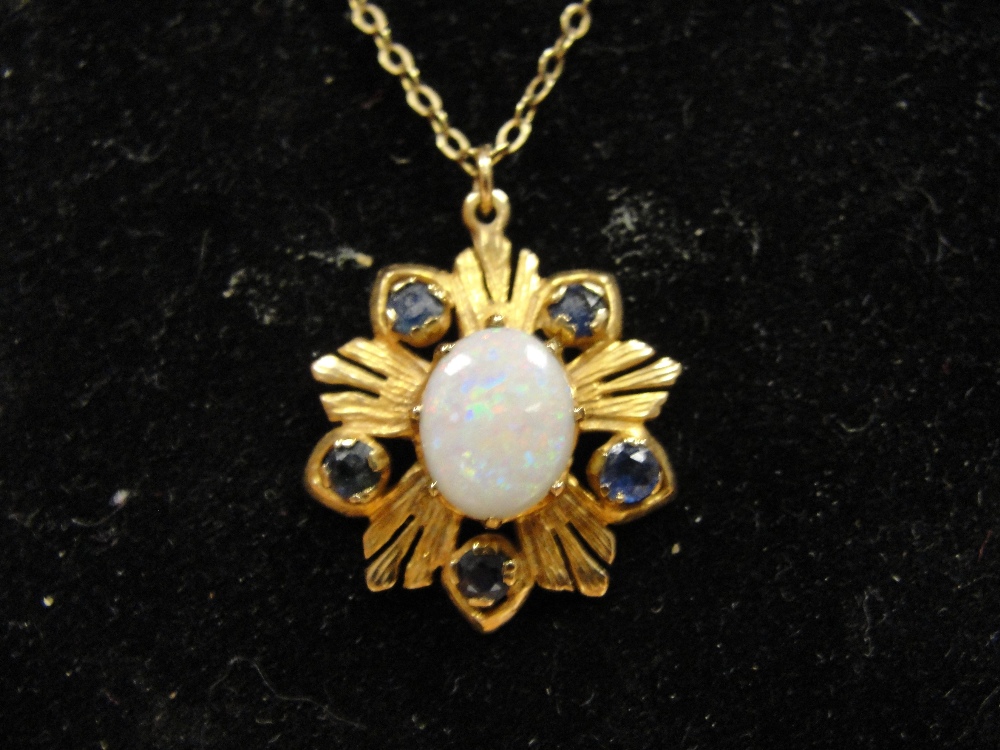 A 9ct opal and sapphire pendant on chain