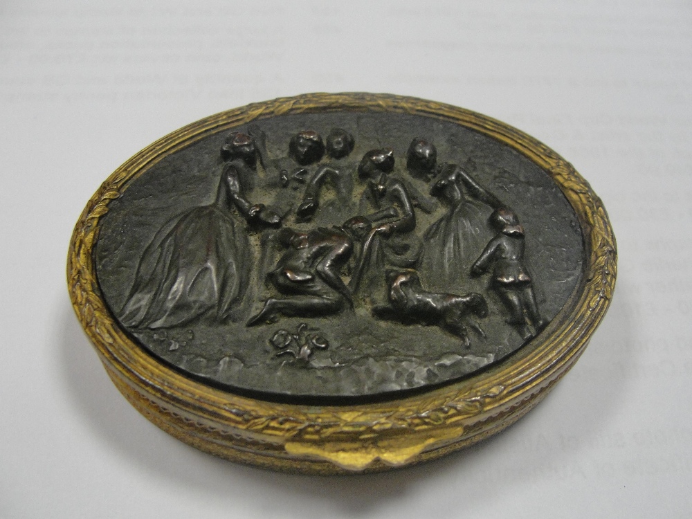 A 1950s French compact with bronze figural top